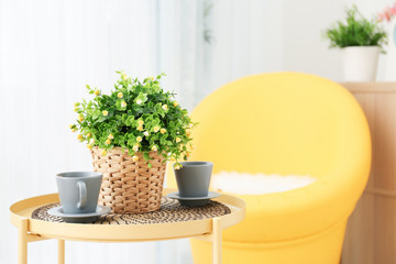 Beautiful modern veranda with cozy armchair and coffee table