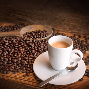Cup of espresso with beans