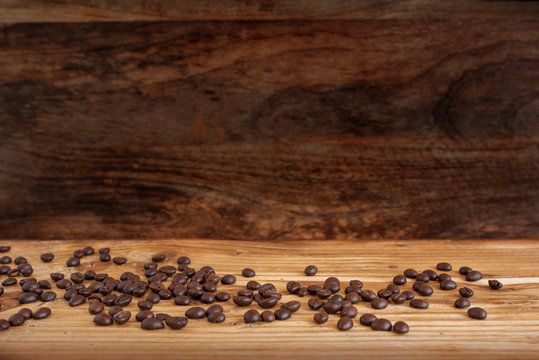 Coffee beans on rustic wood