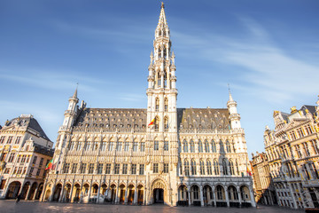 Fototapeta na wymiar Morning view on the city hall at the Grand place central square in the old town of Brussels during the sunny weather in Belgium