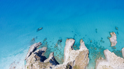 Overhead view of beautiful rocks over crystal clear ocean