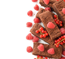 Chocolate brownies with raspberries and currants
