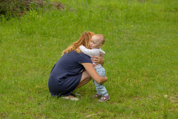 Fototapeta premium Baby girl embrassing her mother for protection