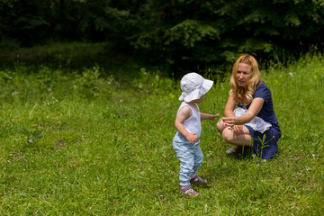 Mother and baby girl in nature