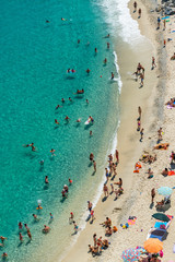 Overhead view of people at the beach, holiday concept