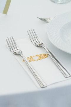forks on napkin, restaurant, ceremony or wedding table detail