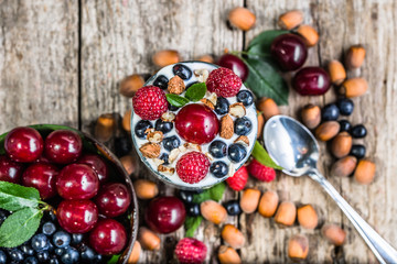 Healthy yogurt with fruits or sundae ice cream in a cup, summer dessert concept