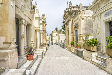 Old cemetery with family graves in Italy