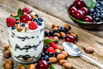 Healthy yogurt with fruits or sundae ice cream in a cup, summer dessert concept