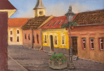 Fototapeta premium Traditional European urban landscape. Old European street with ancient houses, tiled roofs, church and street lights.