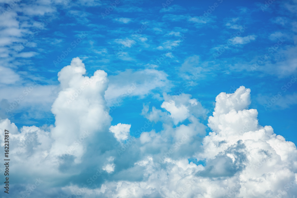 Wall mural blue sky with fluffy clouds, background and texture