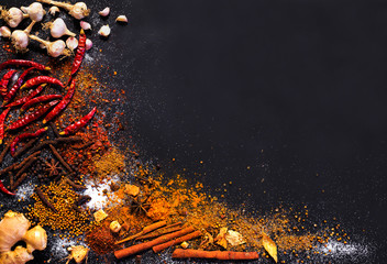 Variety Spices and herbs on black stone background, Top view with empty space background for texture. Italian food, eastern food concept. - 162238217