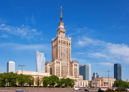 Warsaw city center with Palace of Culture and Science (PKiN), a landmark and symbol of Stalinism and communism, and modern sky scrapers.