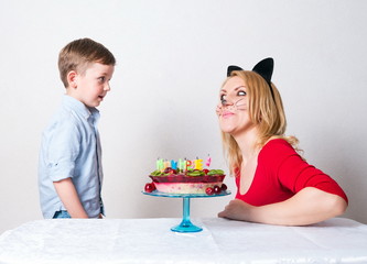 Little boy with mum and the birthday cake