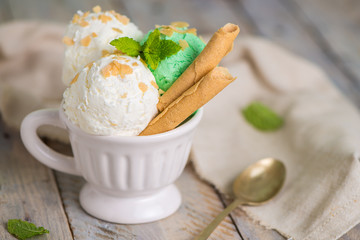 Vanilla and mint ice cream in cup