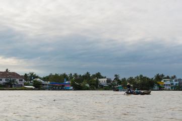 Fototapeta premium Riverside stilt houses in the Mekong Delta