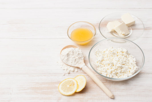 Ingredients for baking cottage cheese on a white table