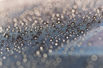 Drops of water on glass in rainy day