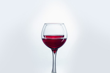 Two wine glasses against white