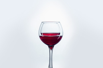 Two wine glasses against white