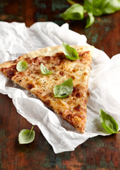 Thin-crust cheese pizza with basil