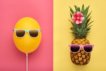 Fashion Pineapple and Pink air Balloon. Bright Summer Color, Accessories. Tropical Hipster pineapple with Sunglasses. Creative Art concept. Minimal style. Summer party background. Fun