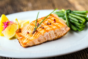 Grilled Salmon. Salmon fillet with lemon and green beans. Grilled fish.