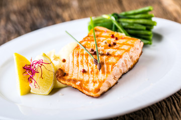 Grilled Salmon. Salmon fillet with lemon and green beans. Grilled fish.