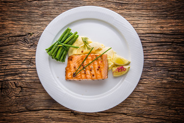 Grilled Salmon. Salmon fillet with lemon and green beans. Grilled fish.