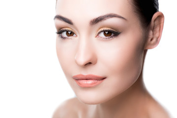 Obraz premium young attractive lady with makeup looking at camera isolated on white