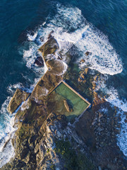 Aerial view of North Curl Curl rock pool with incoming waves