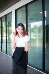 Modern business women casual outfits in the office with copy space, Business woman standing cross one's arm, Asian people young beautiful businesswoman smile. business concept