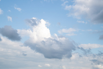 White and grey clouds on the blue sky