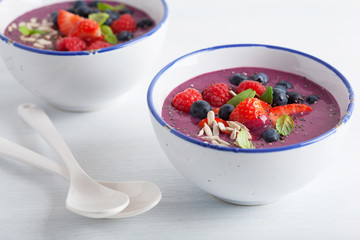 healthy berry smoothie bowl with strawberry blueberry raspberry and chia seed
