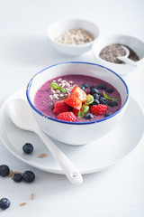healthy berry smoothie bowl with strawberry blueberry raspberry and chia seed