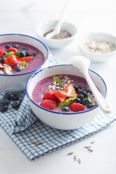 healthy berry smoothie bowl with strawberry blueberry raspberry and chia seed