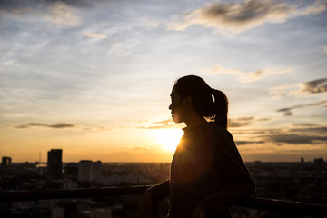 women see city view when sunset time