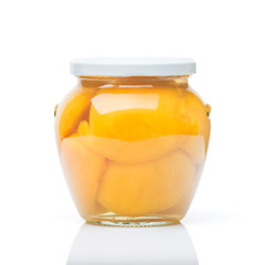 Jar of canned peaches isolated on a white background