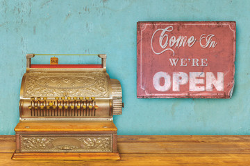 Store concept with cash register and open sign