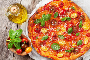 Pizza with tomatoes, mozzarella and basil