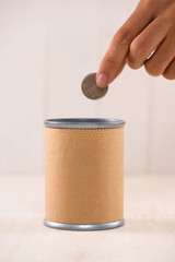 Putting money into donation box. Donate concept.