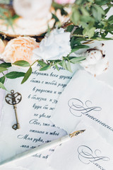 Invitations to wedding, key and flowers