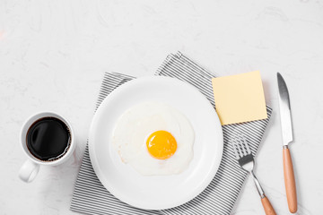 Top view of traditional healthy easy quick breakfast meal made of fried eggs served on a plate.