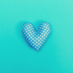 Handmade heart cushions on a blue background