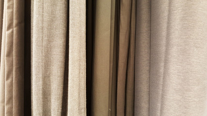 Fototapeta premium group of grey fabric roll selection / stock of grey fabric for fashion design business, raw material in garment manufacturing