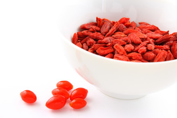 dried goji berries in a small white bowl