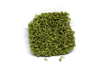 Green noodle on white background.
