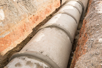Concrete drainage pipe and manhole in construction site.