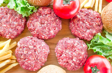 The raw ingredients for the homemade burger on country background.