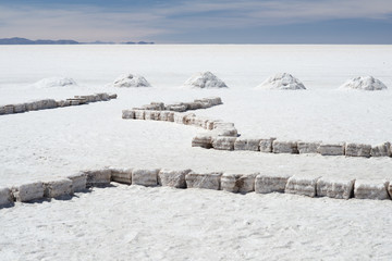 Salt bricks and piles of salt on the world's largest salt flats Salar de Uyuni, Bolivia